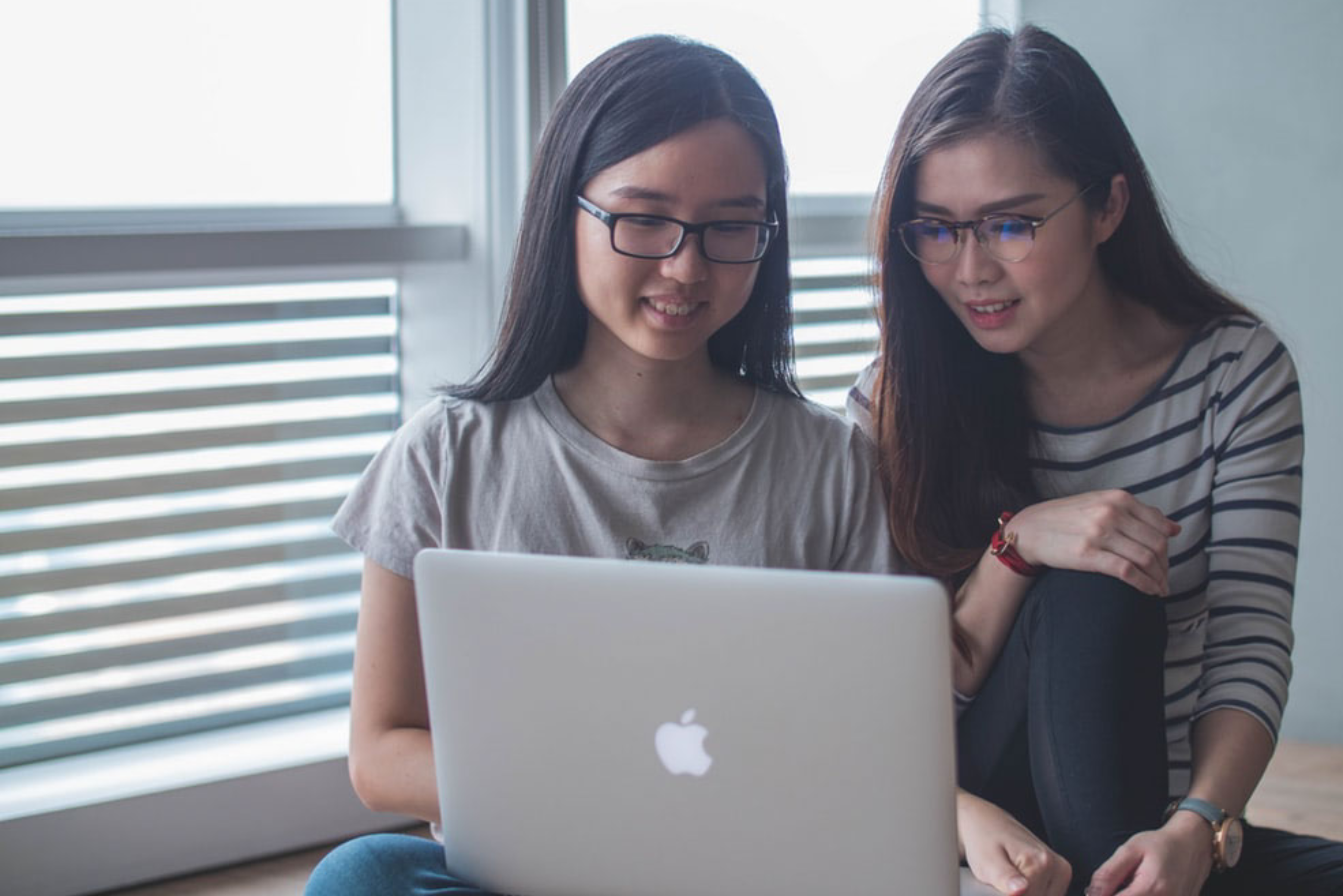 two girls with computer.png